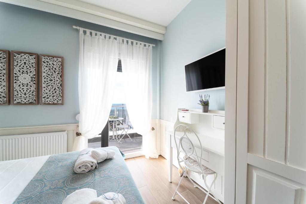 TV a/nebo společenská místnost v ubytování Siel Seaside Homes