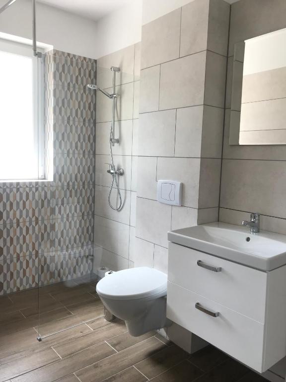 Kúpeľňa v ubytovaní Domki nad Brzegiem