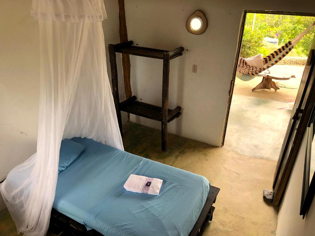 Postel nebo postele na pokoji v ubytování Moon Wind Tayrona Hostel