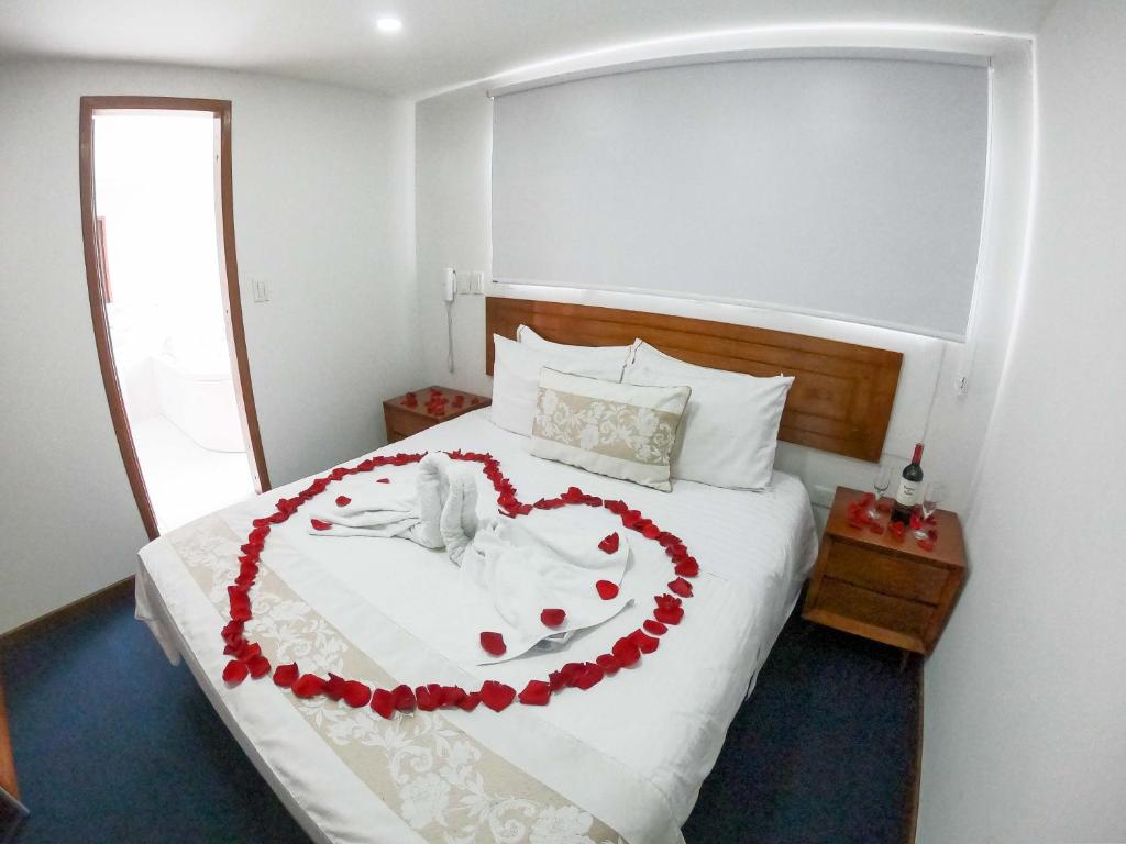 Postel nebo postele na pokoji v ubytování Hotel Estación Sabana