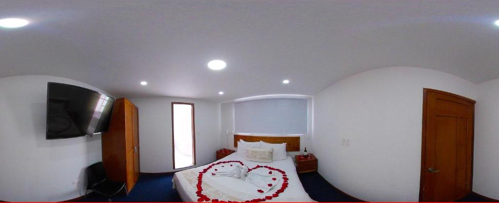 Postel nebo postele na pokoji v ubytování Hotel Estación Sabana