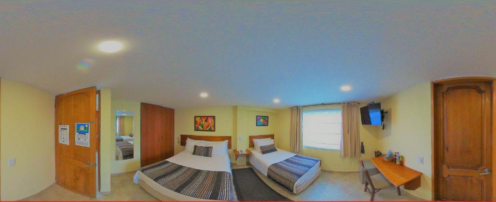 TV a/nebo společenská místnost v ubytování Hotel Estación Sabana