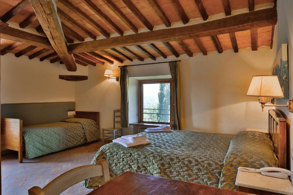 Posteľ alebo postele v izbe v ubytovaní Hotel Relais Santa Genoveffa