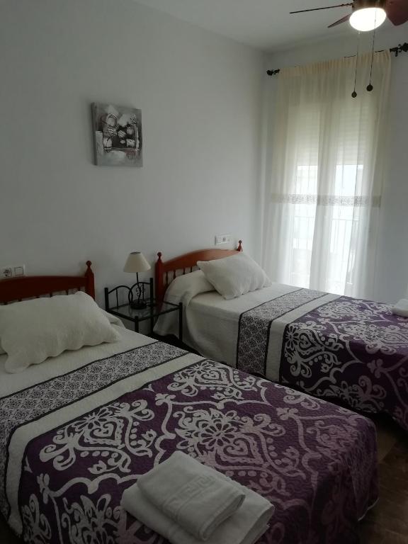 Postel nebo postele na pokoji v ubytování El Descanso