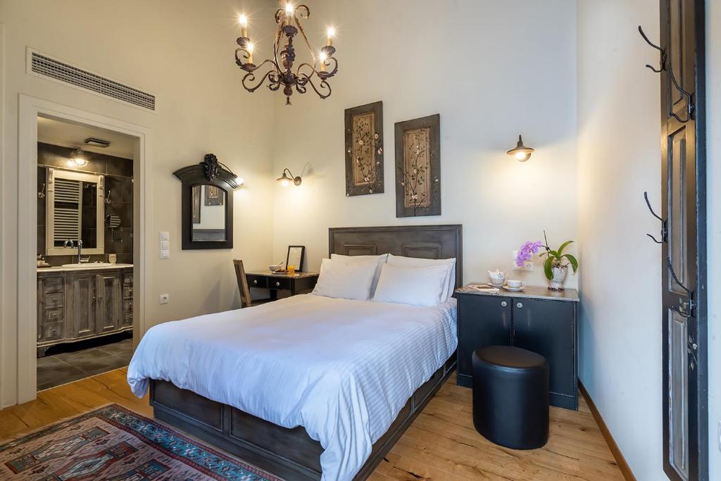 Posteľ alebo postele v izbe v ubytovaní Hotel Antique