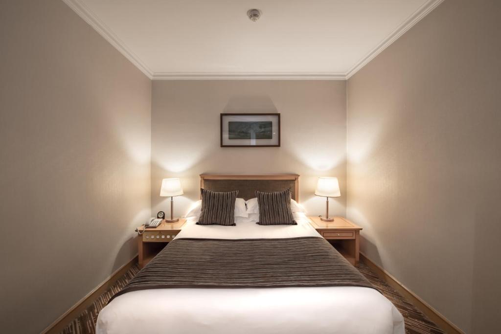 Postel nebo postele na pokoji v ubytování Xiyuan Hotel