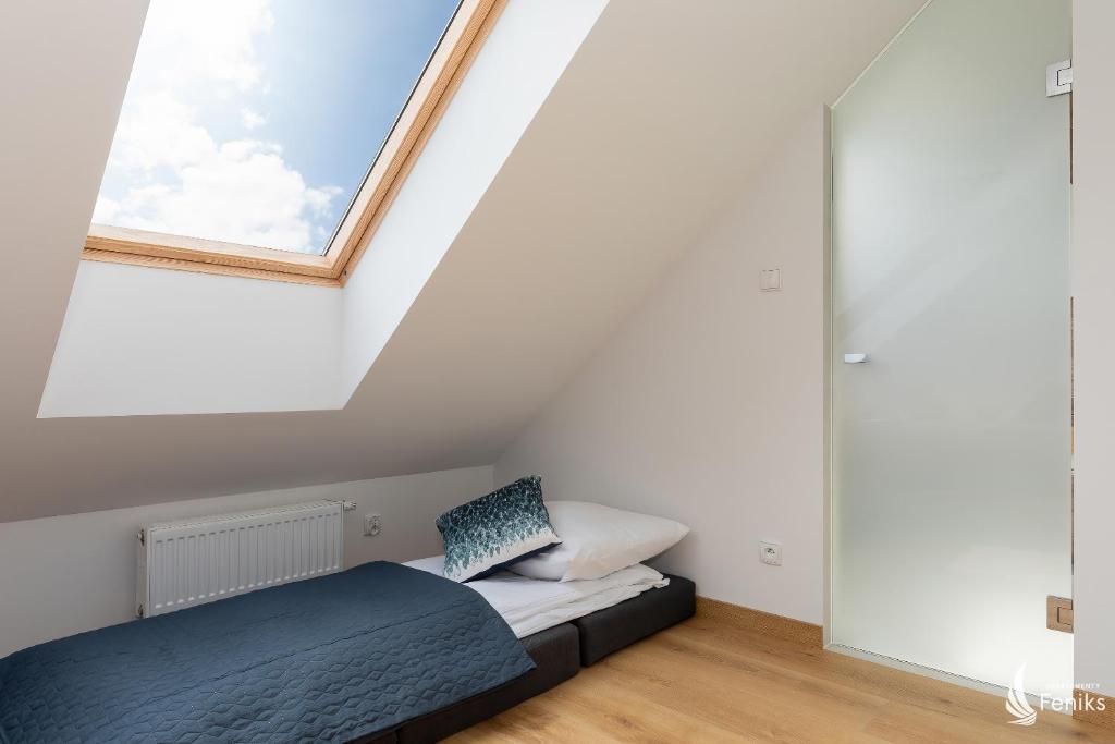 Posteľ alebo postele v izbe v ubytovaní Feniks SPA Apartments 10 by Jantar Apartamenty Kołobrzeg