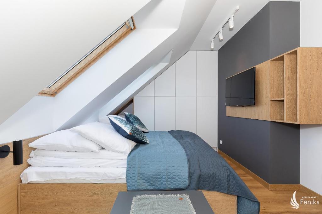 Posteľ alebo postele v izbe v ubytovaní Feniks SPA Apartments 10 by Jantar Apartamenty Kołobrzeg