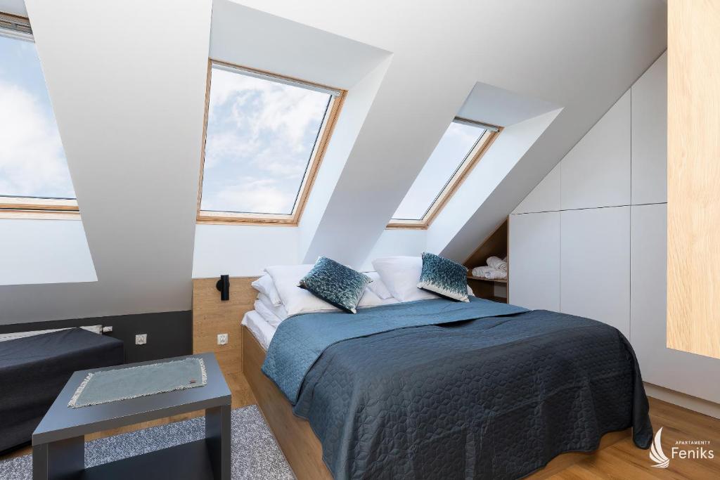 Posteľ alebo postele v izbe v ubytovaní Feniks SPA Apartments 10 by Jantar Apartamenty Kołobrzeg