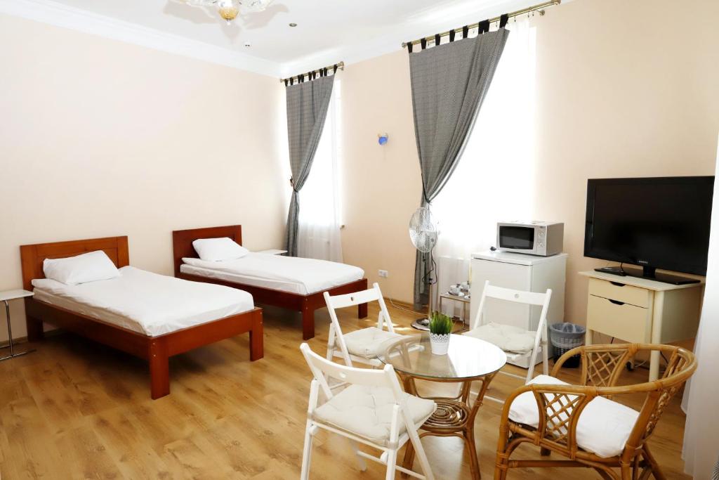 Postel nebo postele na pokoji v ubytování Apartamenti DVINSKA