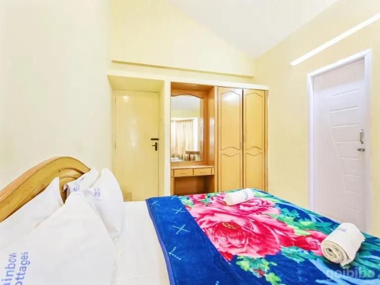 Postel nebo postele na pokoji v ubytování Rainbow Cottages-Budget Friendly rooms