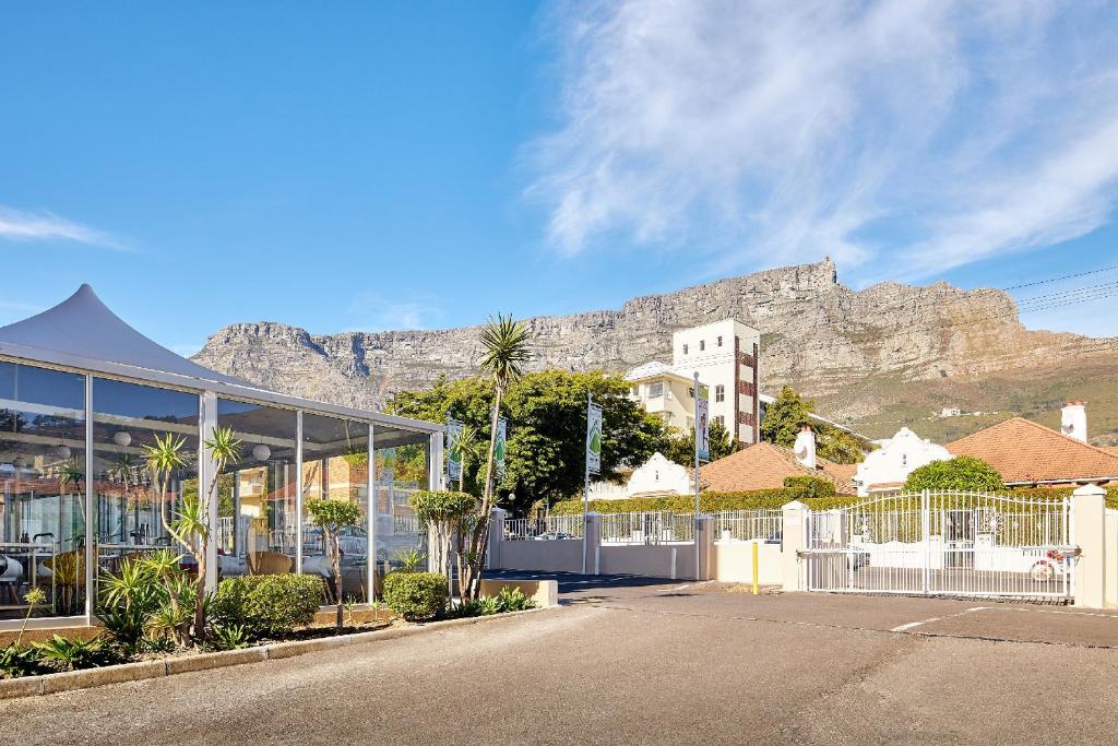 a view of a building with a mountain in the background at First Group Mount Sierra in Cape Town
