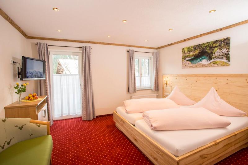 Postel nebo postele na pokoji v ubytování Gästehaus Widderstein