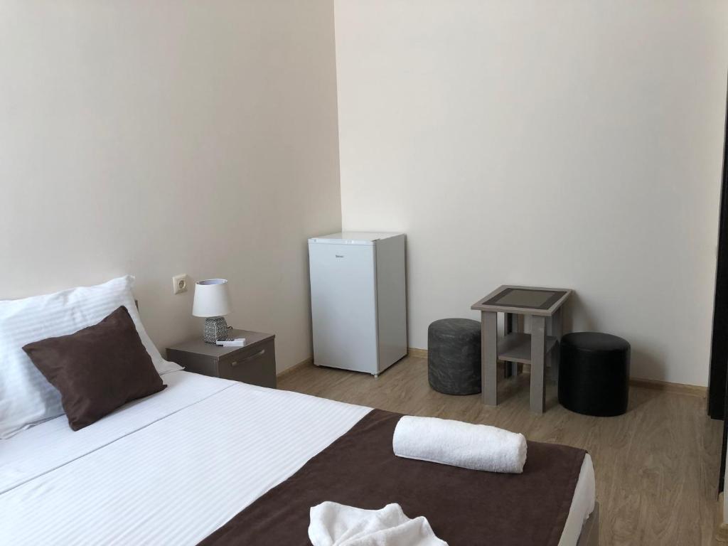 Postel nebo postele na pokoji v ubytování Guesthouse Family