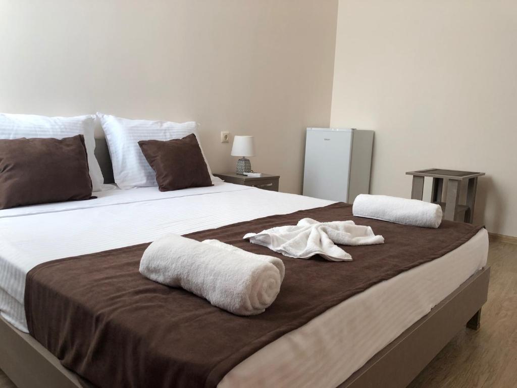Postel nebo postele na pokoji v ubytování Guesthouse Family
