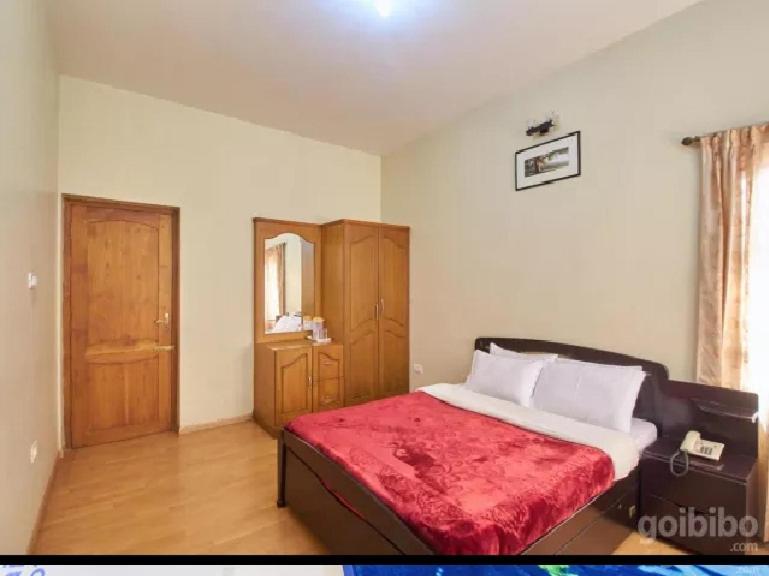 Postel nebo postele na pokoji v ubytování Rainbow Cottages-Budget Friendly rooms