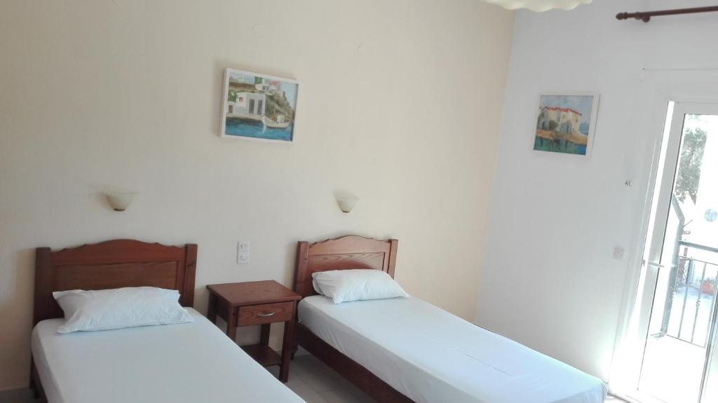 Postel nebo postele na pokoji v ubytování Alexandros Guest House