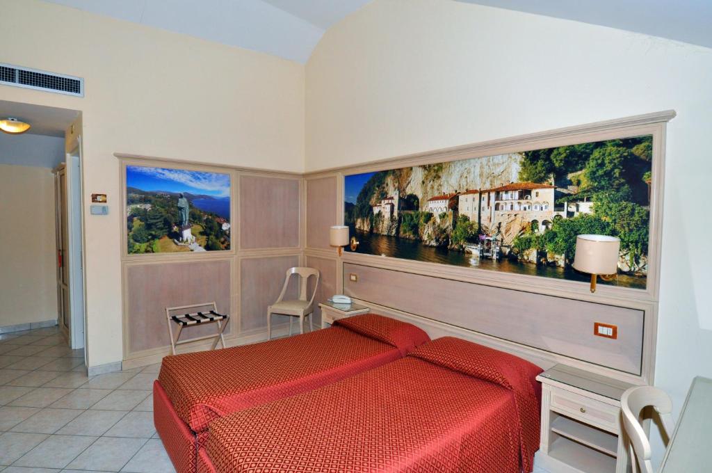 Posteľ alebo postele v izbe v ubytovaní Hotel Moderno - Cavour 30tre
