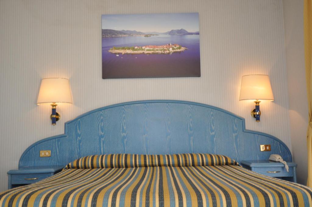 Posteľ alebo postele v izbe v ubytovaní Hotel Moderno - Cavour 30tre