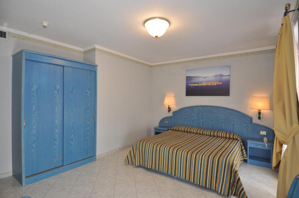 Posteľ alebo postele v izbe v ubytovaní Hotel Moderno - Cavour 30tre