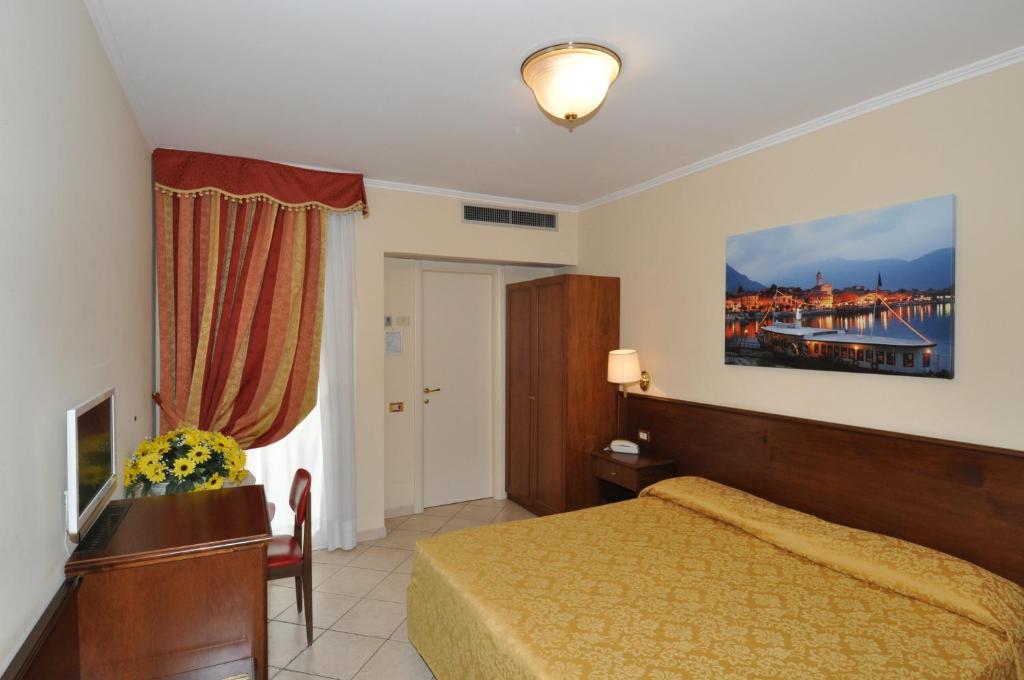 Posteľ alebo postele v izbe v ubytovaní Hotel Moderno - Cavour 30tre