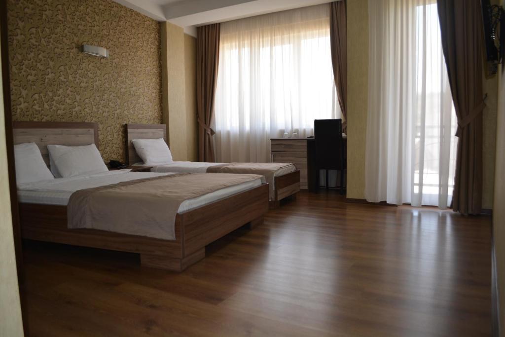 Postel nebo postele na pokoji v ubytování Hotel Gureli