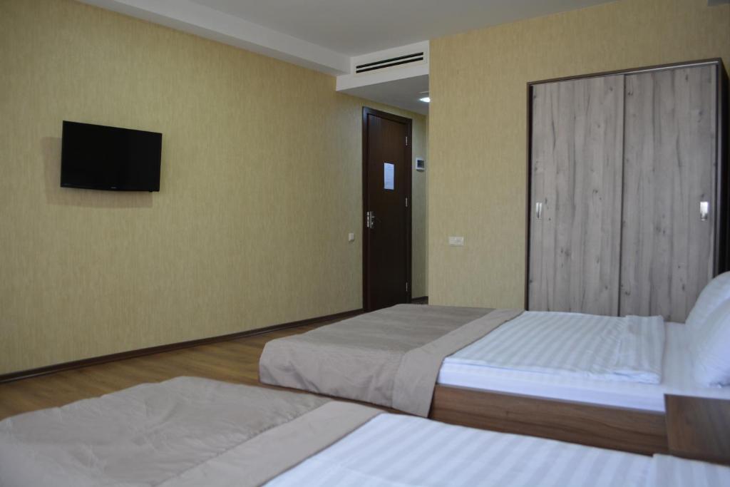 Postel nebo postele na pokoji v ubytování Hotel Gureli