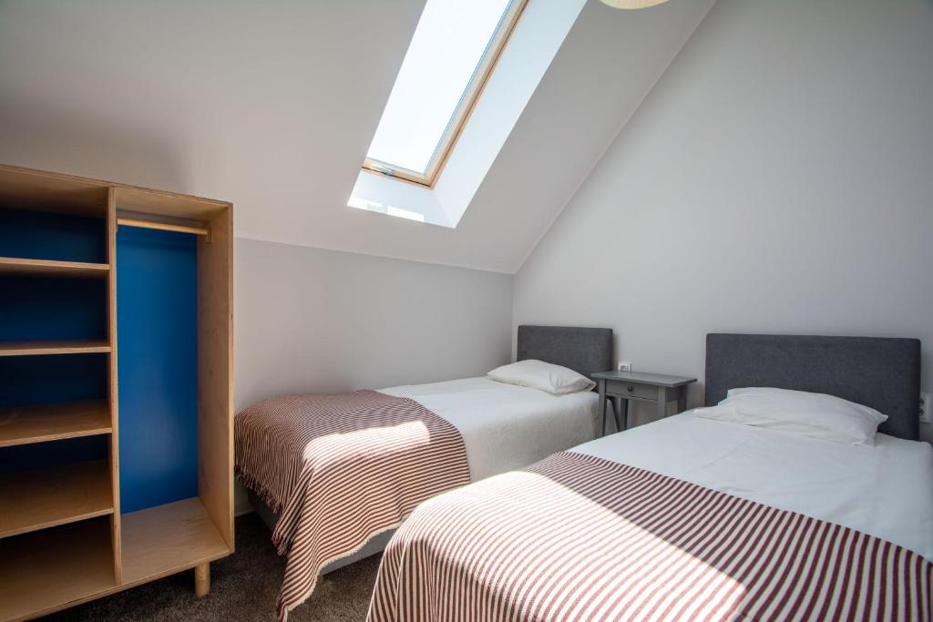 Postel nebo postele na pokoji v ubytování Domy Apartamentowe - Na Makowej