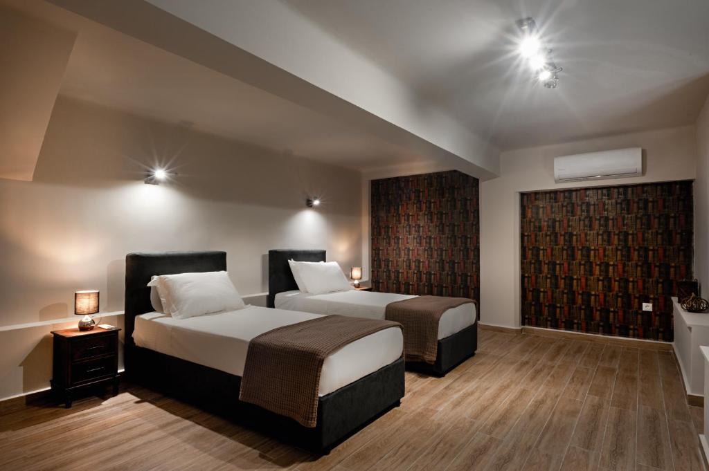 Postel nebo postele na pokoji v ubytování Pallada Athens boutique rooms & apartments