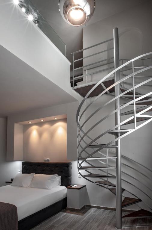 Postel nebo postele na pokoji v ubytování Pallada Athens boutique rooms & apartments