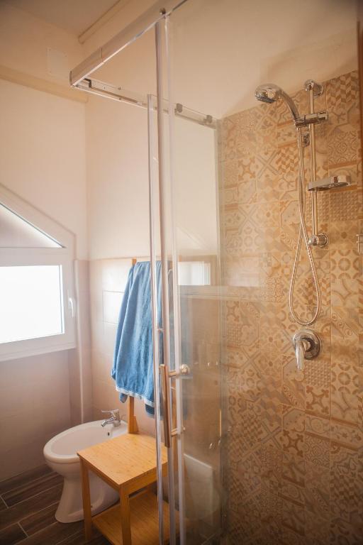 a bathroom with a shower and a toilet at La Bellavista Mola di Bari in Mola di Bari