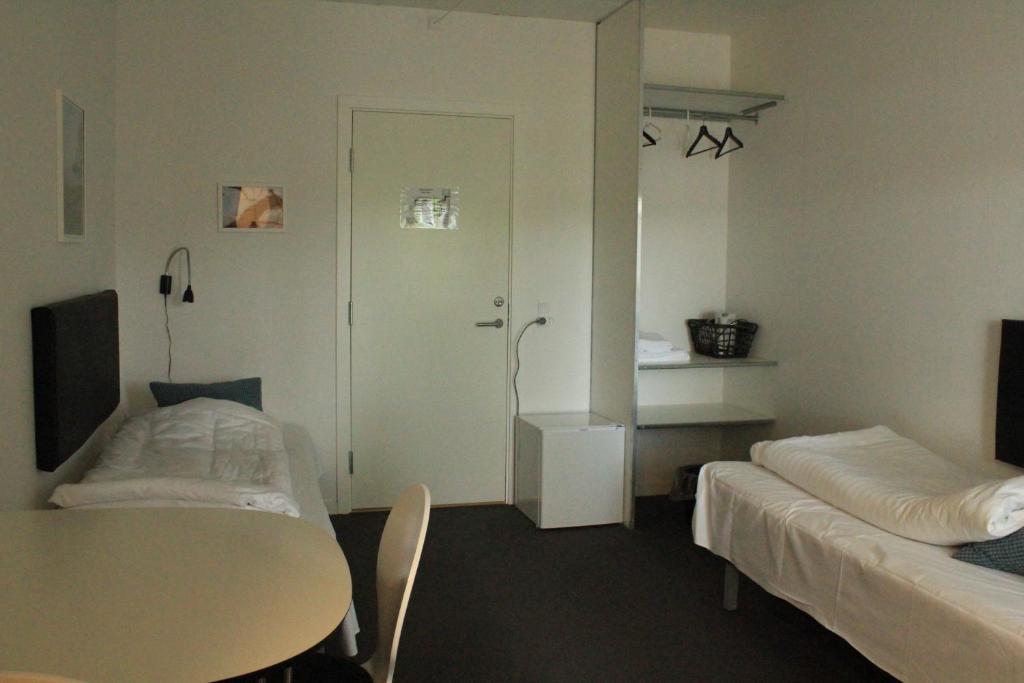 Postel nebo postele na pokoji v ubytování Motel Poppelvej