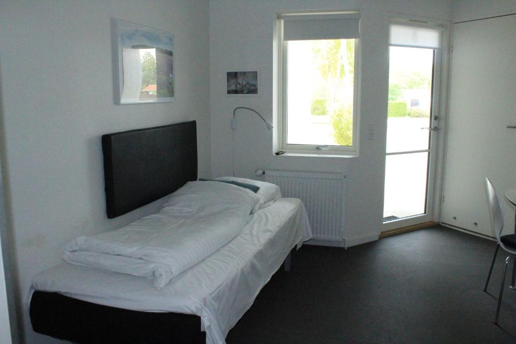 Postel nebo postele na pokoji v ubytování Motel Poppelvej
