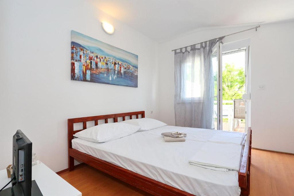 Postel nebo postele na pokoji v ubytování Apartments Golub