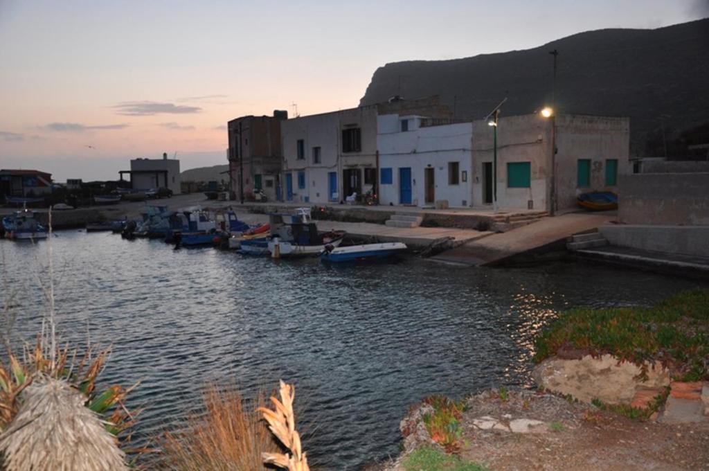 a group of boats are docked in a harbor at Sole e Mare in Favignana