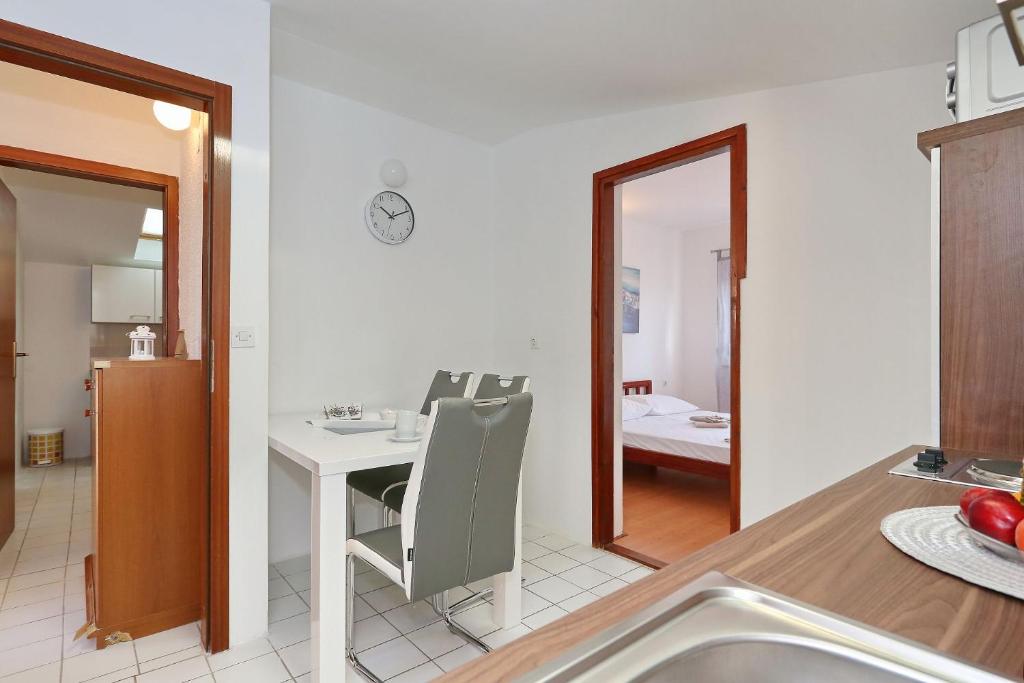 Postel nebo postele na pokoji v ubytování Apartments Golub