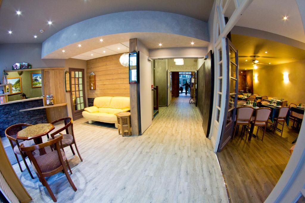 a living room with a couch and a table at hotel les edelweiss in Cauterets