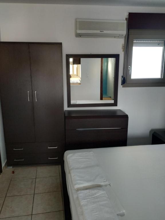 Postel nebo postele na pokoji v ubytování Mavroforos Hotel