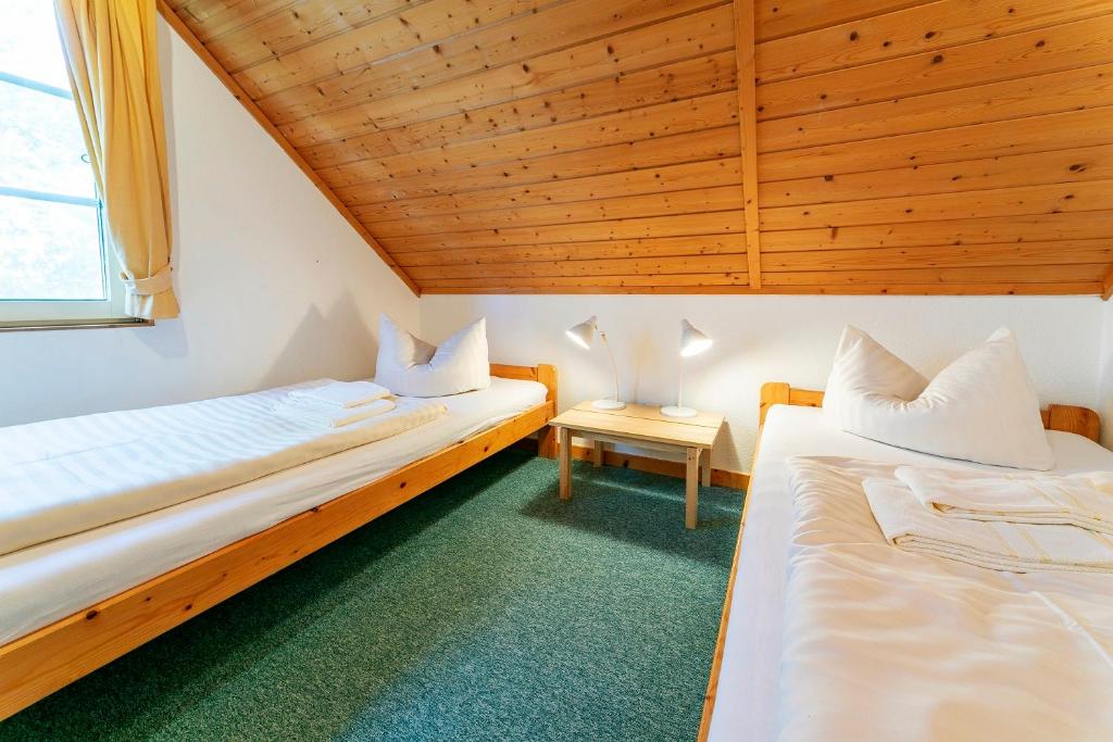 Postel nebo postele na pokoji v ubytování Müritzparadies