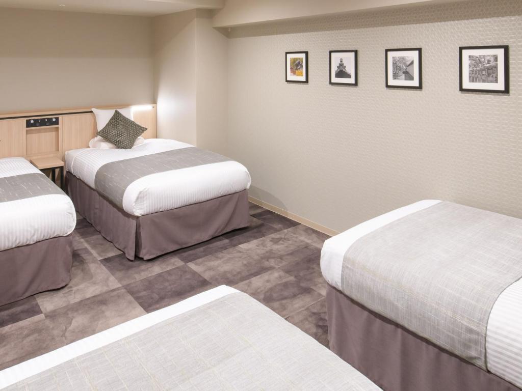 Postel nebo postele na pokoji v ubytování Nara Royal Hotel