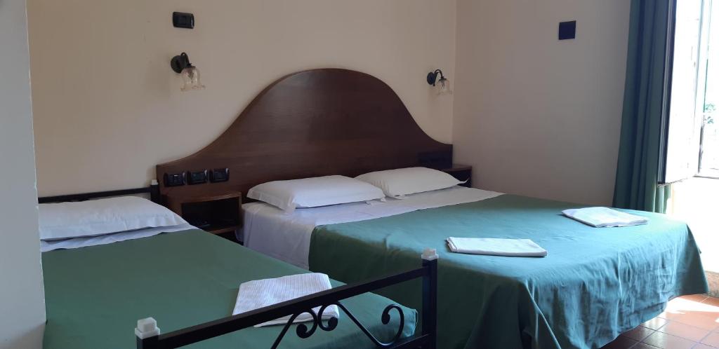 Postel nebo postele na pokoji v ubytování Hotel Al SanPietrino