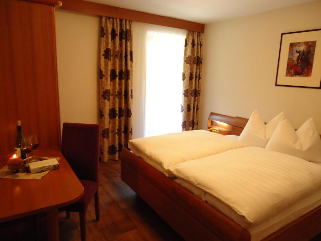 Postel nebo postele na pokoji v ubytování Hotel Klammwirt