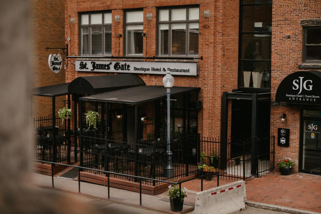 a brick building with a restaurant on a street at St James Gate by Bower Boutique Hotels in Moncton