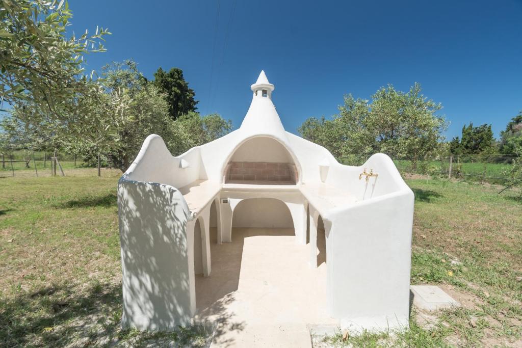 a small white chapel in a field at Sa lampana in Orosei