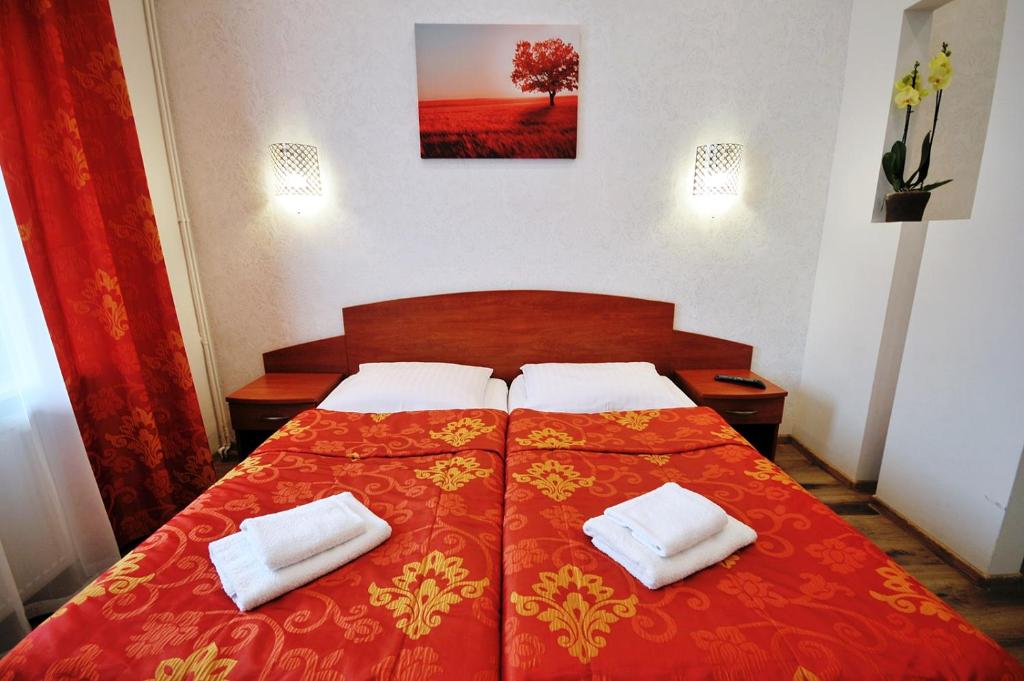 Postel nebo postele na pokoji v ubytování Sanatorium Willa Fortuna