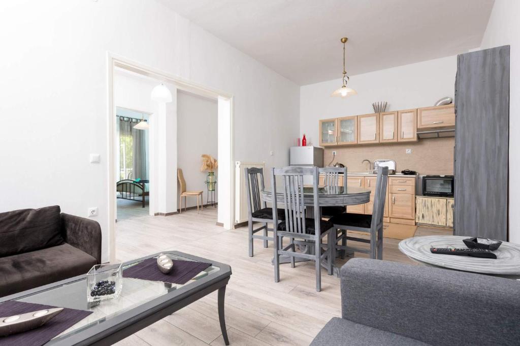 a living room with a couch and a table at Anastasia's Apartment in Limenas