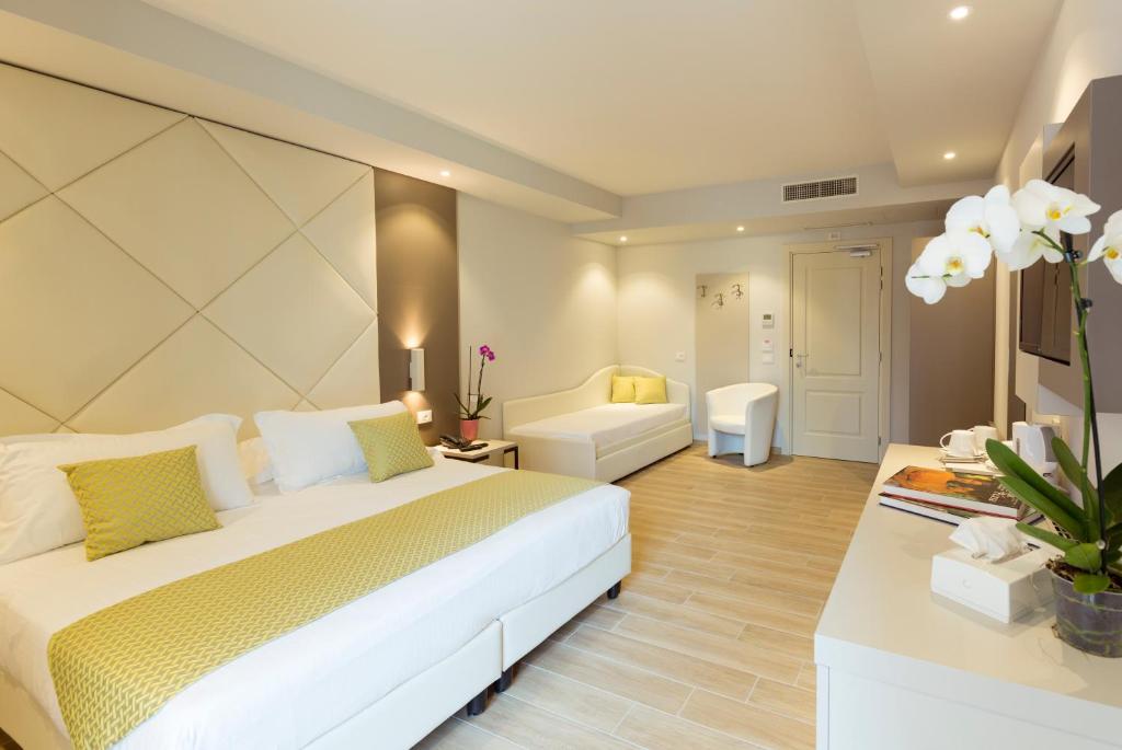Posteľ alebo postele v izbe v ubytovaní Hotel Villa Garuti