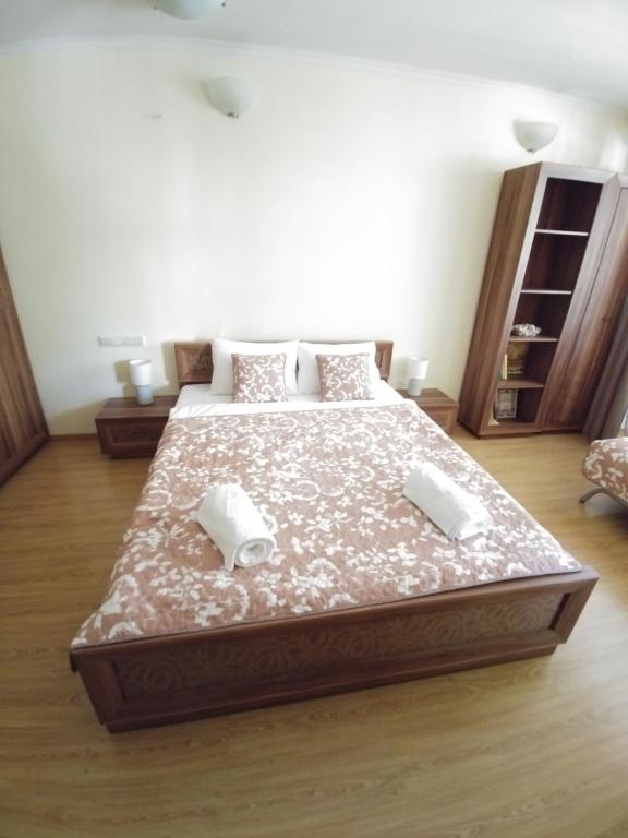 Łóżko lub łóżka w pokoju w obiekcie Sun Apartments City Centre