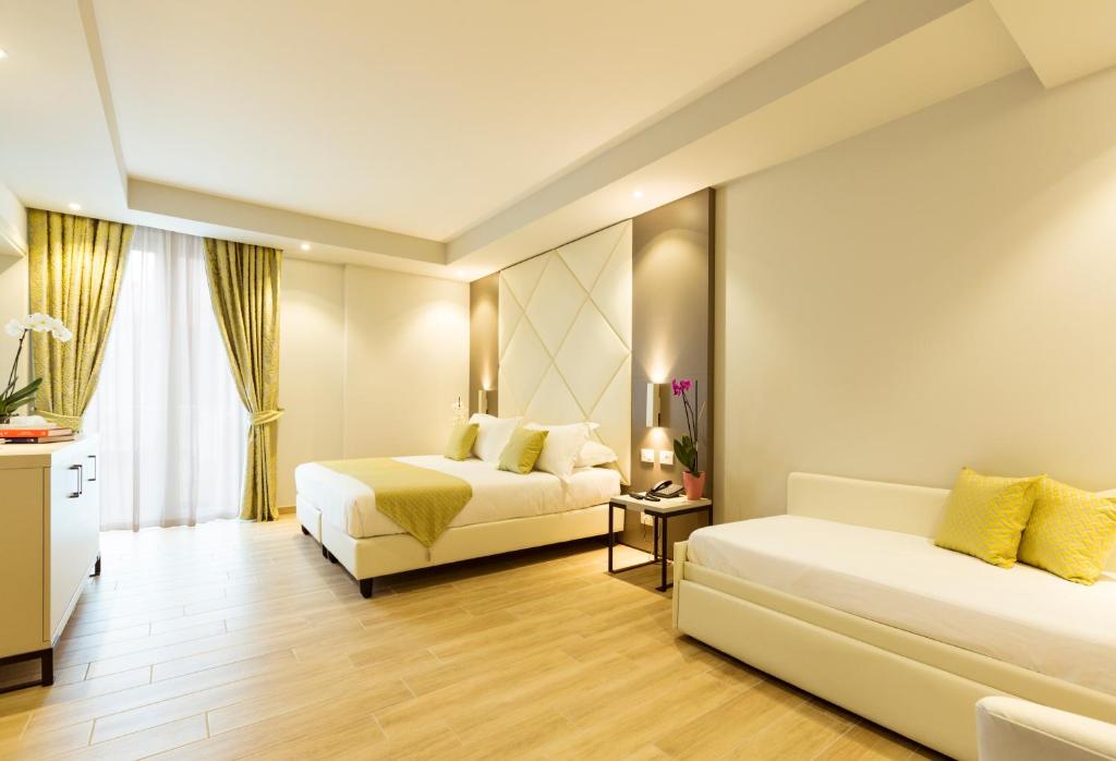 Posteľ alebo postele v izbe v ubytovaní Hotel Villa Garuti
