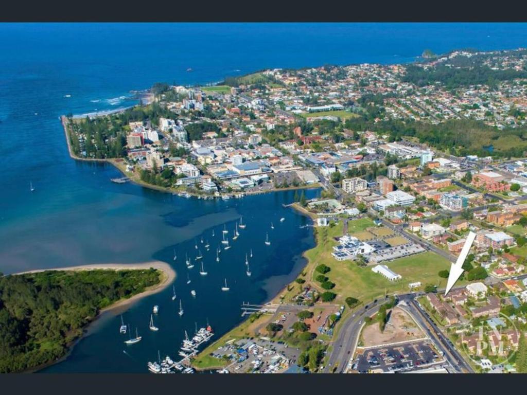 an aerial view of a harbor with boats in the water at Play@PortMacq in Port Macquarie